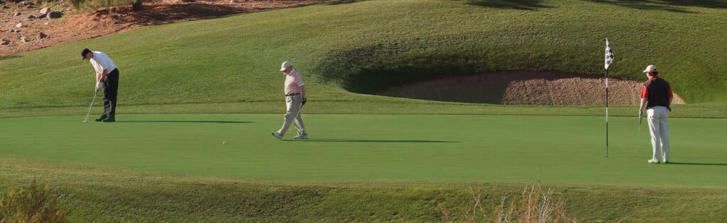 Golfers on Revere Golf Club Lexington Course sixth green - Henderson, Nevada
