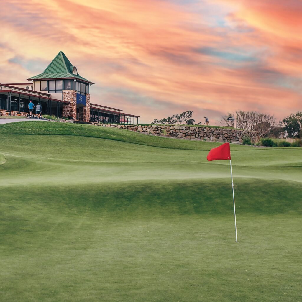 Kurrai course green and clubhouse at Nudgee Golf Club