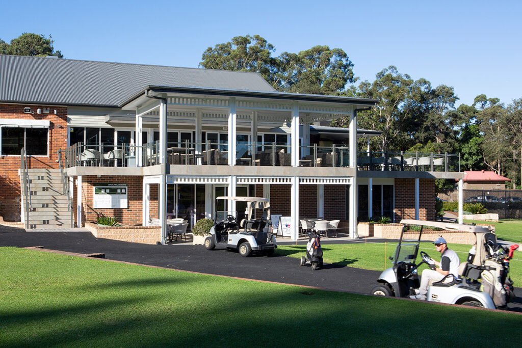 Clubhouse and golf buggies at Pennant Hills Golf Club