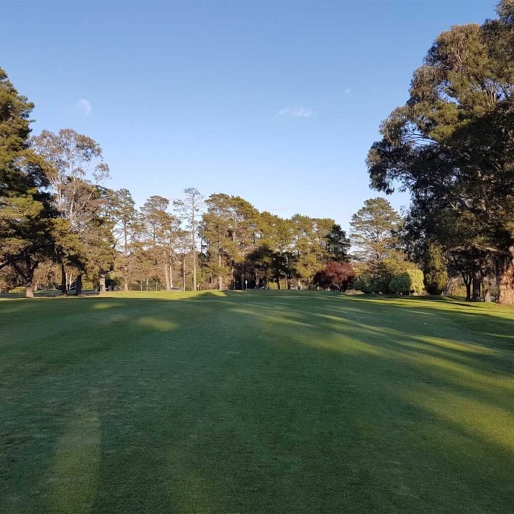 Parkland fairway framed by trees at Queanbeyan Golf Club