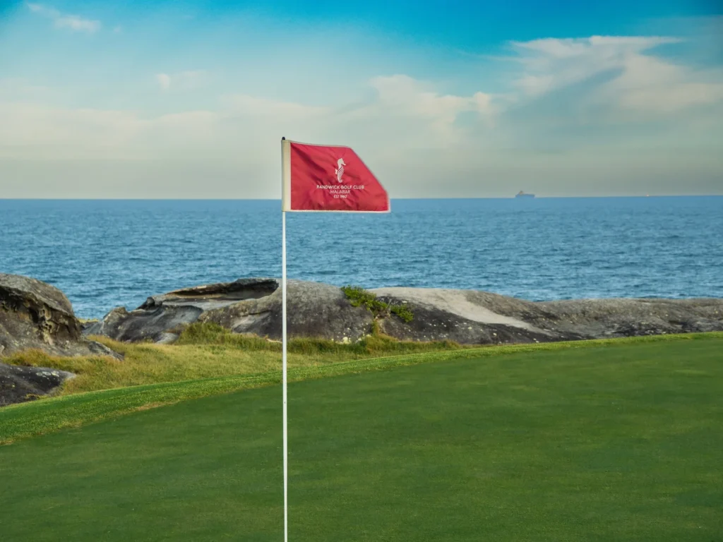 Randwick Golf Club Malabar flag beside the ocean